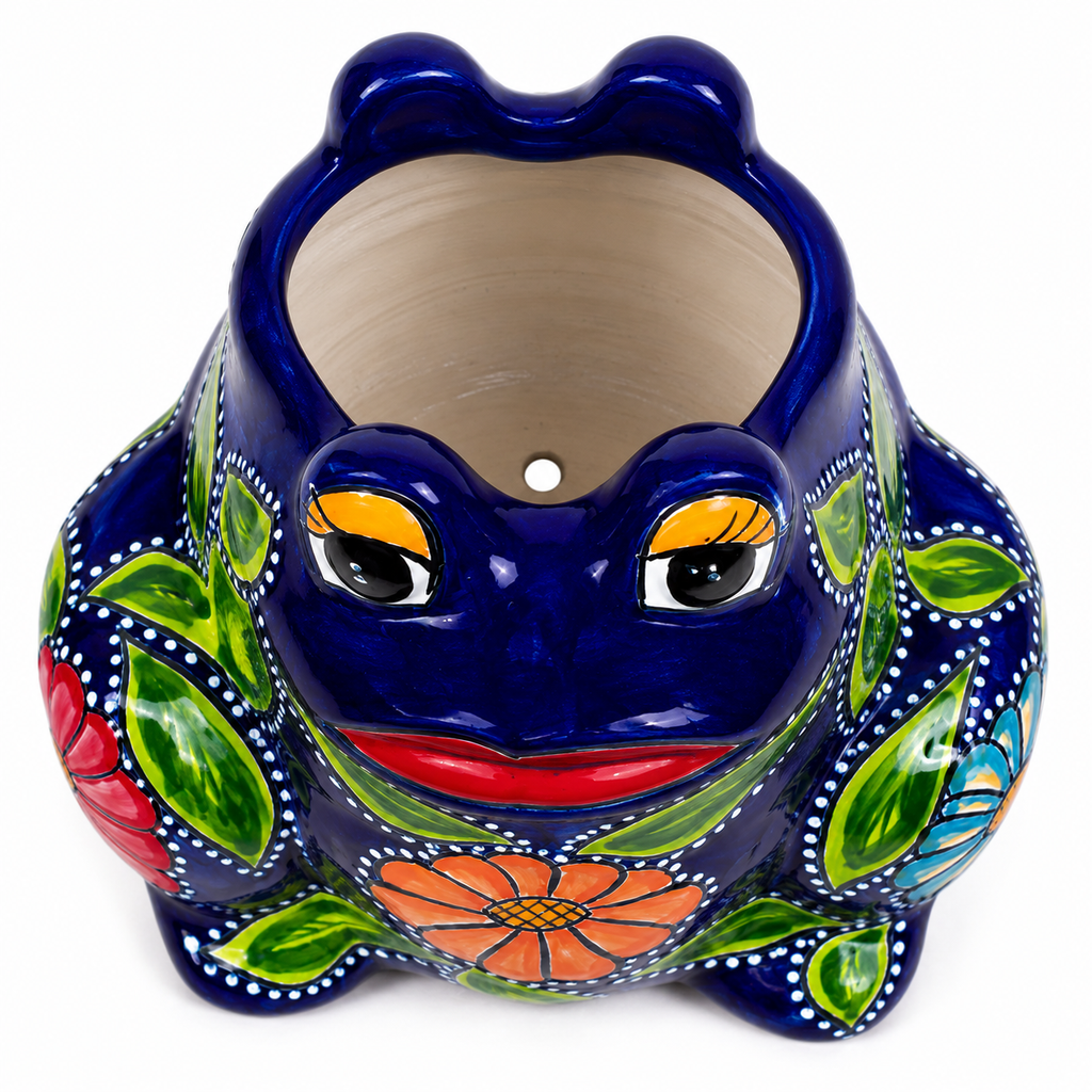 A ceramic frog-shaped planter pot with a glossy dark blue body, hand-painted green leaves, orange and red flowers, and yellow eyes on a white background.