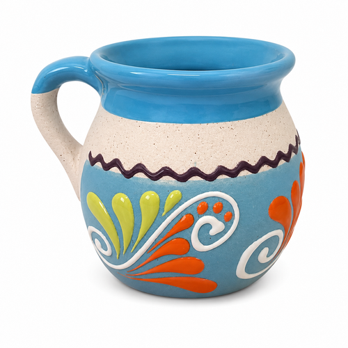A ceramic mug with a turquoise blue glazed finish, a speckled beige lower body, and colorful hand-painted floral patterns in orange, yellow, white, and a dark purple border.