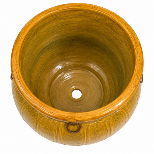 A round ceramic planter pot with a glossy glazed finish, featuring a wide opening, a central drainage hole, and subtle vertical ribbed detailing on the exterior, shown against a plain white background.