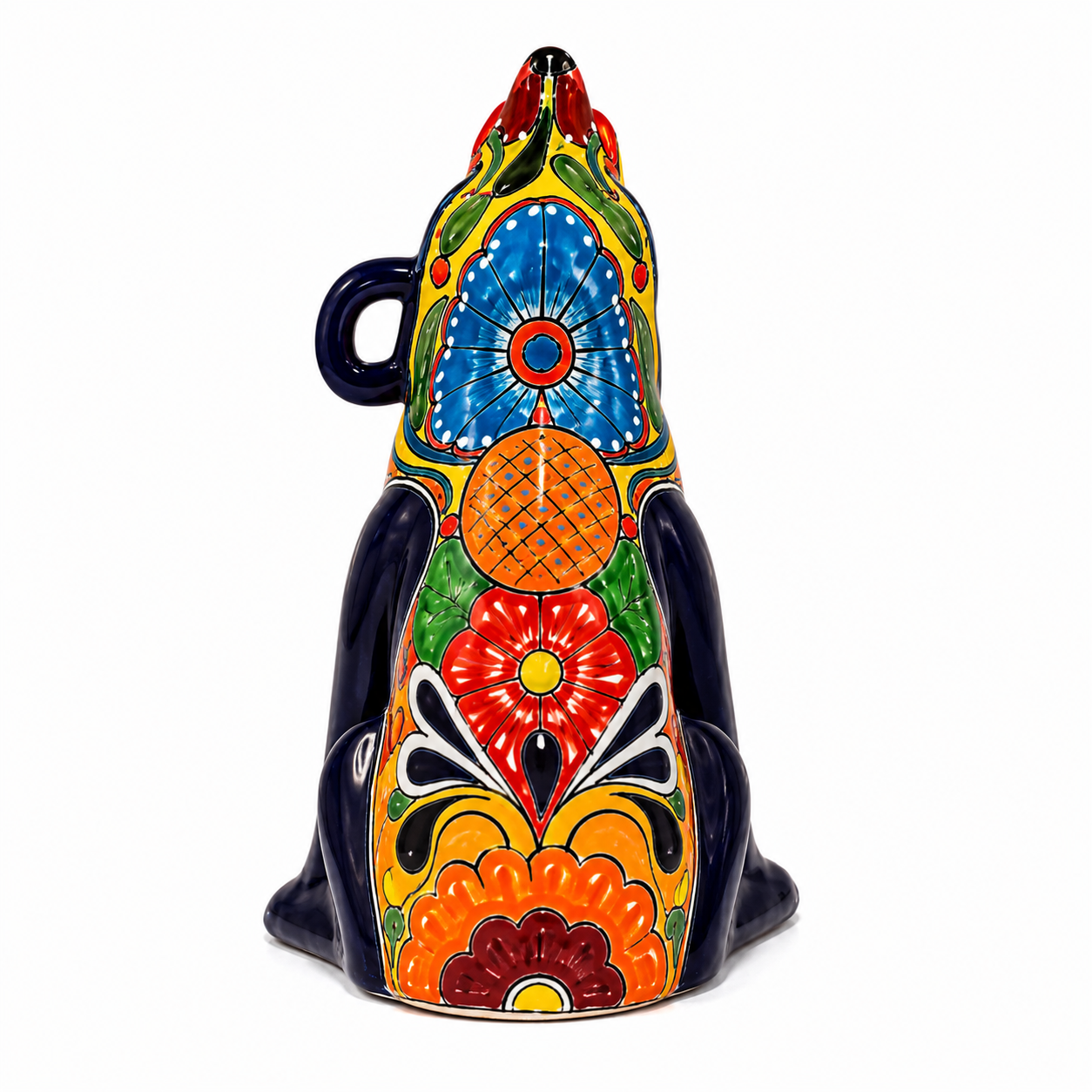A hand-painted ceramic dog figurine decorated with vibrant, traditional Mexican Talavera-style patterns in blue, red, orange, green, yellow, and black on a white background.