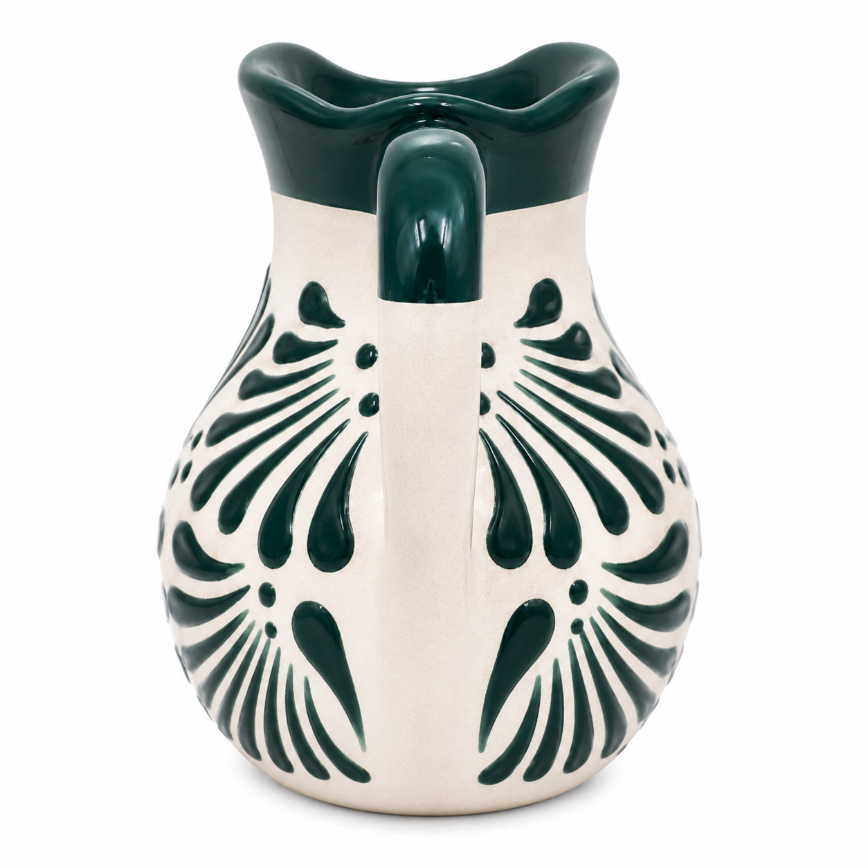 Ceramic pitcher with green floral patterns on a white background