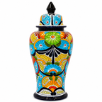 A hand-painted ceramic lidded jar with a vibrant, multicolored floral pattern on a white background.