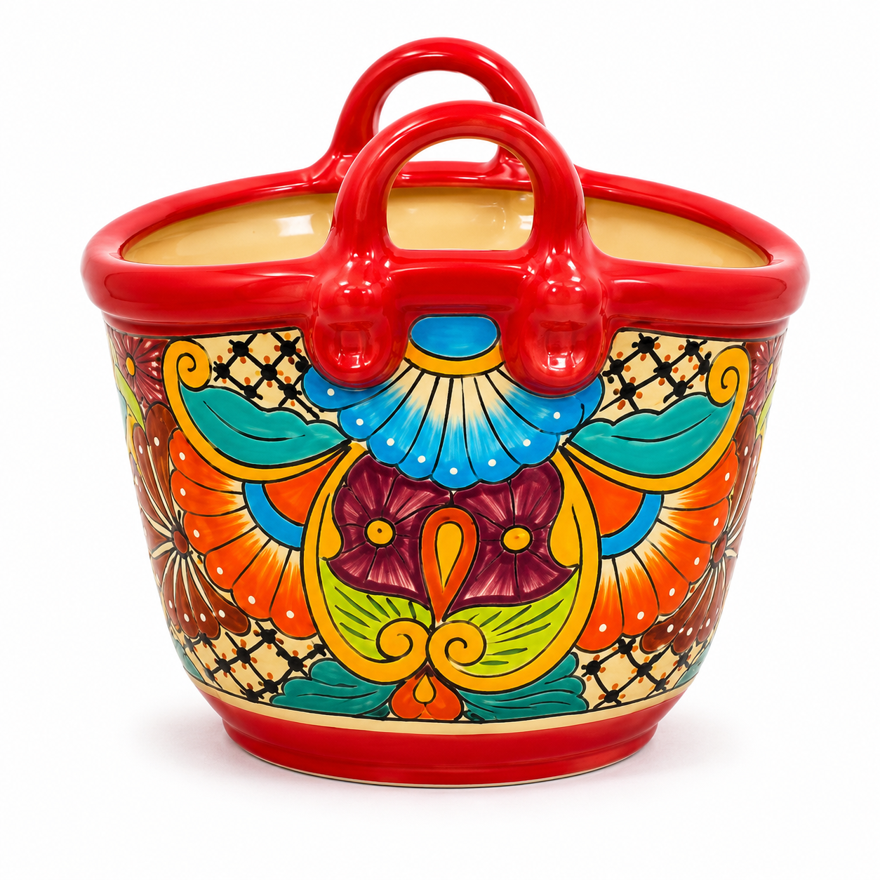 A colorful ceramic basket-shaped planter with red handles and a hand-painted traditional pattern in orange, blue, green, yellow, and purple on a white background.